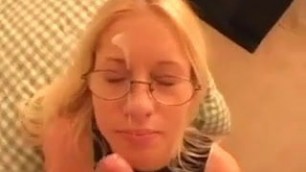 Blonde with glasses doesn't like the cum on her face